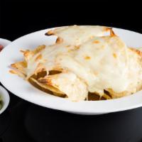 Mexican Nachos · Served with salsa, guacamole and sour cream topped with melted cheese.