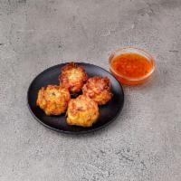 Thai Dumplings · Minced chicken mixed with water chestnut and coriander. Served with sweet and sour dipping s...