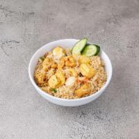 Pineapple Fried Rice · Sauteed eggs, onions, scallions, tomatoes, pineapple and cashew nuts.