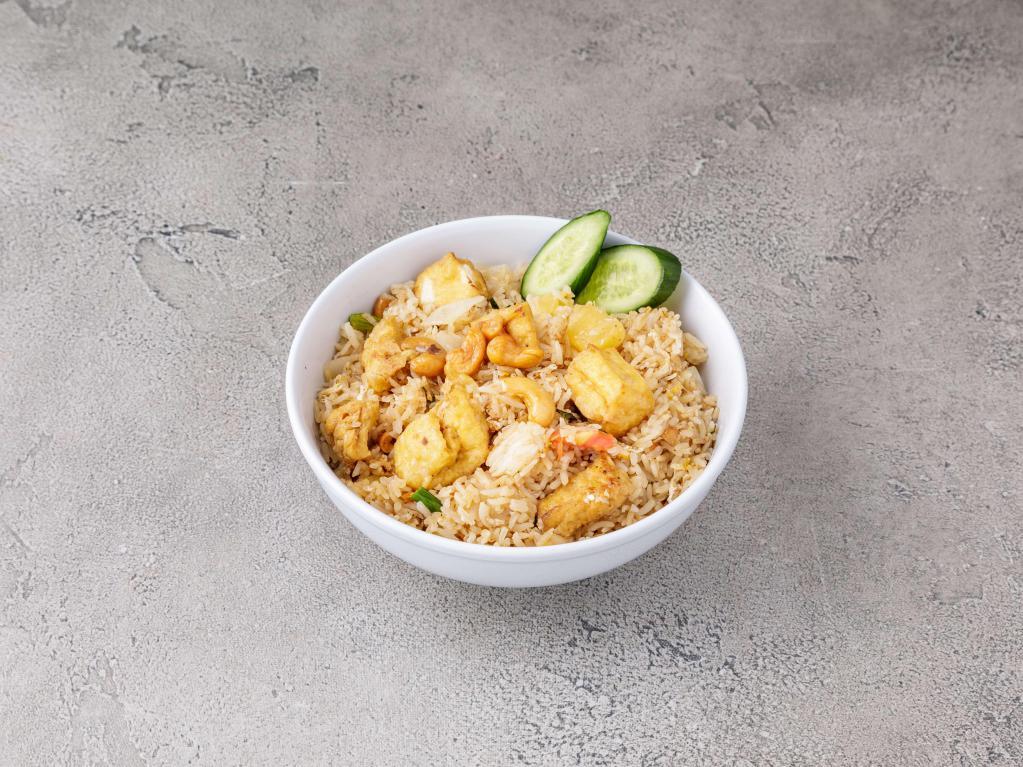 Pineapple Fried Rice · Sauteed eggs, onions, scallions, tomatoes, pineapple and cashew nuts.