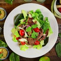 Beef Salad · Yum neau. Marinated grilled beef, cucumbers, onions, tomatoes and cilantro on a bed of lettu...