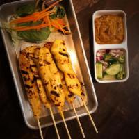 Chicken Satay · Marinated grilled chicken on skewers, served with peanut sauce and cucumber sauce.