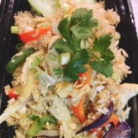 Green Curry Fried Rice · Choice of meat mixed with green curry sauce, bamboo shoots, bell peppers, basil, and eggplant.