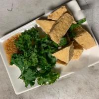F17. Fried Tofu · Fried tofu served with sweet chilli sauce topped with grounded peanut. Gluten-free. Vegan.
