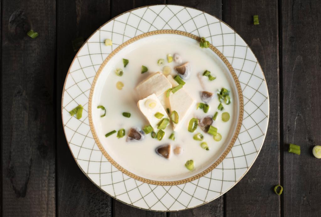 S2. Coconut Soup · The light creamy and sour taste of coconut milk and Thai herb broth comes with mushrooms. Gluten-free.