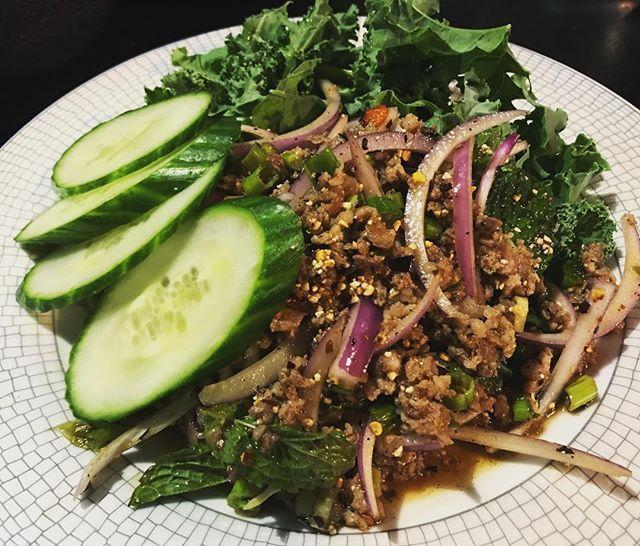 E32. Lucky Piggy · Larb. Spicy and sour ground pork salad mixed with Thai herbs, mint, scallion, red onion, and rice powder served with rice on the side. Gluten-free, spicy.