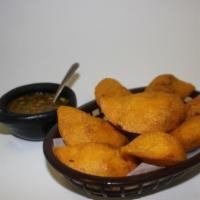 Empanadas Colombianas · Corn flour patty filled with ground beef and marinated Colombian spices. Try it with homemad...