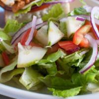 Ensalada de la Casa · House salad. Chopped fresh lettuce, tomatoes and onions.