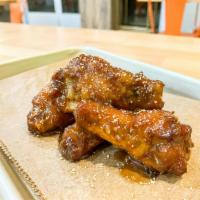 Peanut Butter Wings · Homemade peanut butter & jelly sauce sprinkled with crushed peanuts.