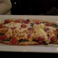 390543. Margarita Pizza · Mozzarella cheese, small tomatoes and sweet basil.