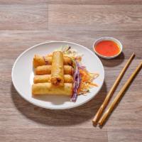 5. Spring Rolls · Deep fried, ground chicken, silver noodles and black pepper, wrapped in egg rolls. Served wi...