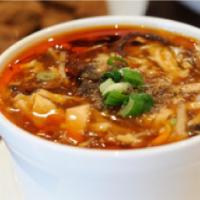 13. Hot and Sour Soup · Served with pork. Hot and spicy.