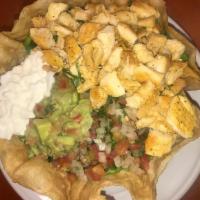 Taco Salad · Hard shell flour tortilla, Choice of Meat, Rice, Beans, Romaine Lettuce, Pico de Gallo, Guac...
