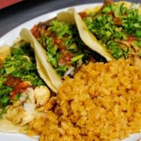 Three Taco Plate · 3 tacos -Corn Tortilla, Choice of Meat, Cilantro, White onion. Includes rice and beans with ...