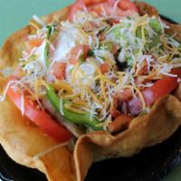 Taco Salad · Flour tortilla shell fried with romaine lettuce, tomatoes, onions, avocado beans, sour cream...