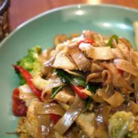 Pad Kee Mow · Flat rice noodle sauteed with egg, chili, broccoli, seasonal Asian green, tomatoes and sweet...