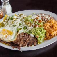 Chilaquiles with Eggs and Cecina Breakfast Platter · Chilaquiles with eggs and Cecina. Served with rice and refried beans.