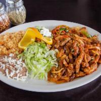 Bistec a la Mexicana Dinner · Mexican style steak. Served with salad, refried beans and rice.