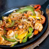 Fajitas Dinner · Served with salad, refried beans and rice.