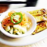 Chicken Satay (4) · Skewers of marinated chicken served with peanut sauce and cucumber salad. Gluten free.