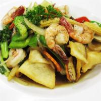 Crispy Chow Fun · Stir fried mixed veggies in gravy sauce on top of crispy wide rice noodles.