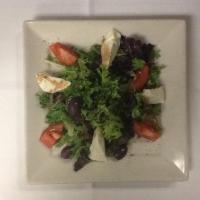 Caprese Salad · Tomatoes, fresh mozzarella and Kalamata olives and mixed greens with balsamic vinegar and ol...