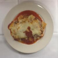 Lasagna · Layers of pasta with bolognese sauce, ricotta, mozzarella and pecorino cheese.