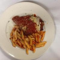 Chicken Parmigiana · Lightly breaded and fried topped with marinara sauce and melted mozzarella. Served with penn...