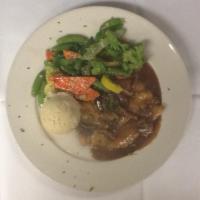 Chicken Marsala · Sauteed with mushrooms in a Marsala wine sauce. Served with mashed potatoes and vegetable of...