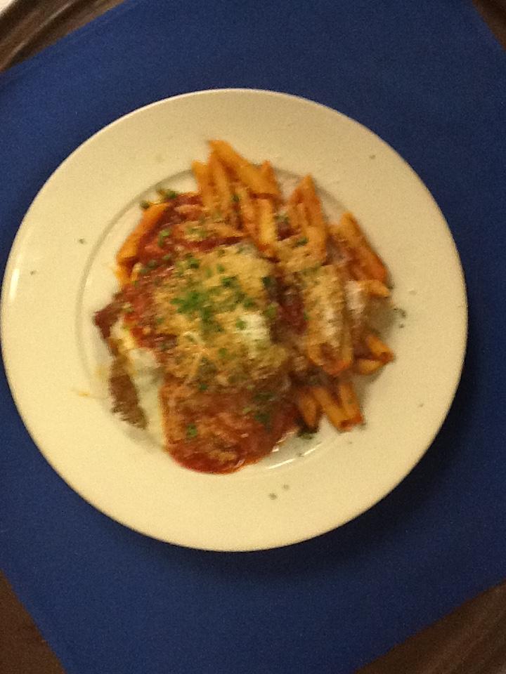 Veal Parmigiana · Lightly breaded and fried topped with marinara sauce and melted mozzarella. Served with a side of penne marinara.