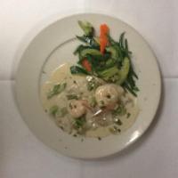 Veal Nicola · Sauteed veal medallions topped with asparagus tips and shrimp finished in a sherry cream sau...