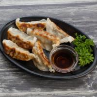 6 Pieces Gyoza · Pan fried Japanese pot stickers made of chicken, pork, and veggies. Served with ponzu sauce.