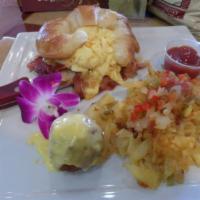 HoneyBaked Ham Croissant'wich · Lightly toasted croissant filled with scrambled eggs, cheddar cheese and HoneyBaked Ham. Ser...