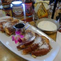 Original French Toast · 3 slices of sweet egg bread dipped in custard and griddled to a golden brown. Served with ma...