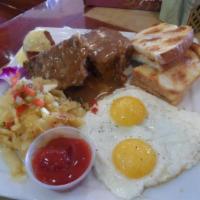 Meatloaf and Eggs · 2 slabs of our mom's meatloaf with a side of mushroom Swiss gravy, two eggs your way, served...