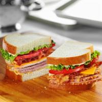 HoneyBaked Club Sandwich · Double decker sandwich piled high with HoneyBaked Ham, roasted turkey, HoneyBaked sweet baco...