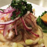 Ceviche Pescado · Pieces of fish marinated with lime juice, sweet potatoes and Peruvian corns.