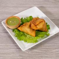 Vegetable Samosa · Crispy fried pastry stuffed with fresh potatoes green peas and freshly ground Indian spices....