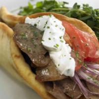Gyro Wrap · Seasoned beef, onions, tomatoes, lettuce, feta cheese and tzatziki sauce. Served hot with fr...