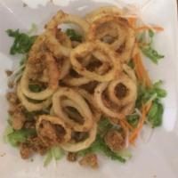 A14. Fried Calamari · Lightly battered calamari rings fried to golden brown, served with sweet chili sauce.