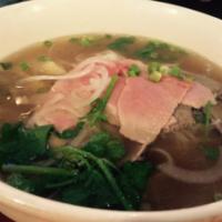 P1. Pho Nomenon Noodle Soup · Eye round steak, well done brisket, soft tendon and tripe. Served with bean sprouts, basil a...
