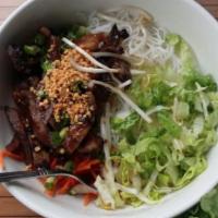 B1. Grilled Pork on Rice Vermicelli · Marinated charbroiled sliced pork. Served with fresh vermicelli noodles accompanied by a bed...