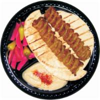 2. Chicken Lula and Hummus · Served with hummus, pickled turnip, 2 slices of pita bread.