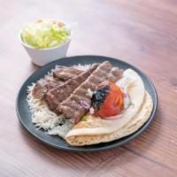 13. Beef Sultani · Beef shish and beef lula served with basmati rice, green salad, broiled tomato, sliced onion...