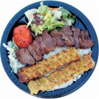 16. Beef Shish and Chicken Lula · Beef shish and chicken lula combination served with basmati rice, green salad, broiled tomat...
