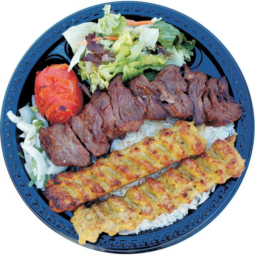 16. Beef Shish and Chicken Lula · Beef shish and chicken lula combination served with basmati rice, green salad, broiled tomato, sliced onion and pita bread.