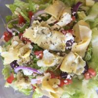 Mediterranean Salad · Romaine lettuce, artichoke hearts, feta, Kalamata olives, red onions, tomatoes and basil. Se...