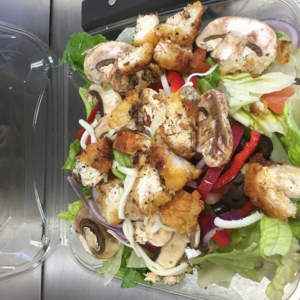 Crispy Chicken Salad · Romaine lettuce, mushrooms, red onions, olives, bell peppers, tomatoes, cheddar cheese and diced chicken strips. Served with choice of dressing.