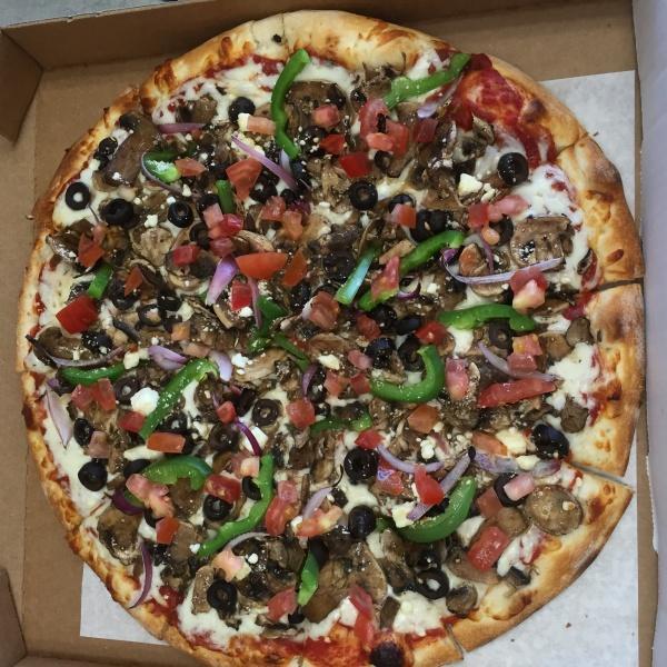 Veggie Garden Pizza · Marinara sauce, mozzarella cheese, mushrooms, olives, red onions, bell peppers, fresh tomatoes and feta cheese. All pizza crusts are brushed with butter sauce.