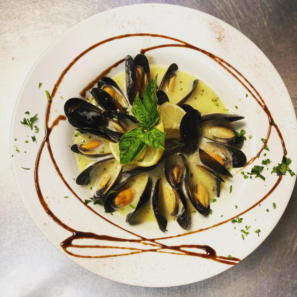 Fresh Mussels · With fresh marinara sauce.
